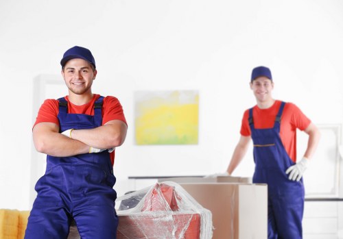 Removal van and moving team planning a Barnes house move