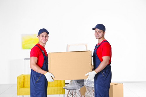 Man and van moving service in Barnes with local residential street background