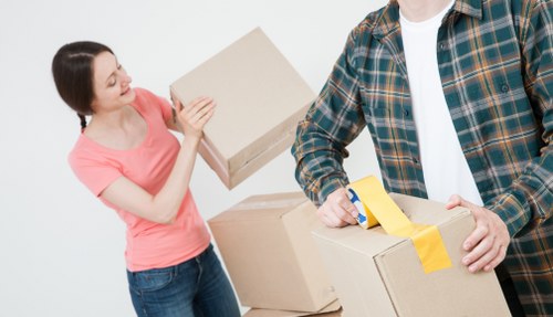 Moving van and boxes arranged for a smooth Barnes removal service