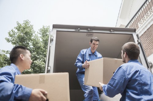 Man with van team preparing a transport booking and checking items