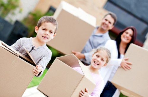 Local moving team loading furniture into a removals van in Barnes