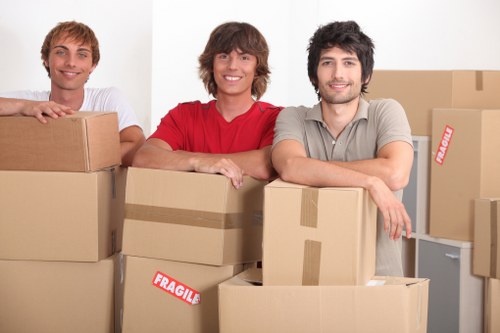 Careful unloading of household items into a new home in Barnes