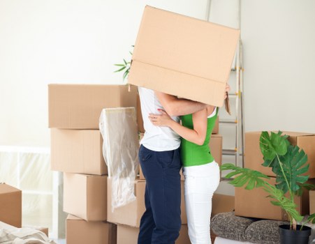 Furniture and boxes being arranged securely inside a removals van