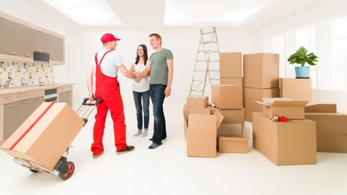 Packing boxes and furniture for a Barnes moving truck service
