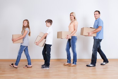 Packed boxes and furniture prepared for removal services in Barnes